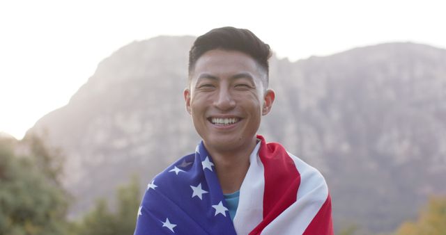 Smiling Man Wrapped in US Flag Outdoors - Download Free Stock Images Pikwizard.com