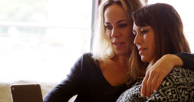 Two Women Bonding Over a Shared Moment at Home - Download Free Stock Images Pikwizard.com