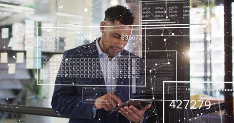 Businessman Analyzing Digital Data on Tablet in Modern Office - Download Free Stock Images Pikwizard.com