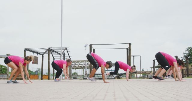 Group of Women Exercising Outdoors Performing Burpees - Download Free Stock Images Pikwizard.com