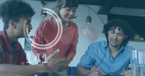 Team Collaborating on Futuristic Data Dashboard Analysis