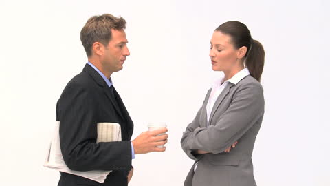 Business Professionals Engaging in Conversation During Break