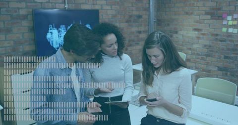 Reviewing 3d schematic team collaborating with tablet and smartphone in modern brick office