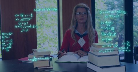 Student Studying with Data Processing Graphics in Library