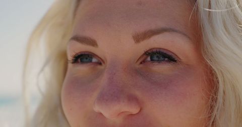 Close-up of Smiling Woman with Blonde Hair on Sunny Beach - Download Free Stock Images Pikwizard.com