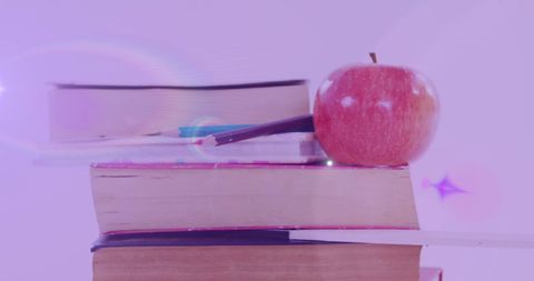 Glowing Apple on Books Represents Literacy and Knowledge - Download Free Stock Images Pikwizard.com