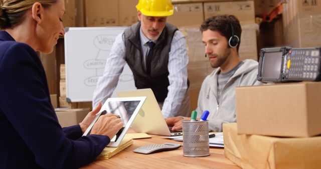 Business Team Working on Logistics Plan in Warehouse - Download Free Stock Photos Pikwizard.com