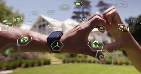 Couple Forming Heart Over Sustainability Icons