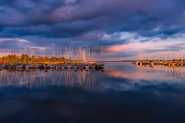 Serene Sunset Over Marina with Sailboats and Dramatic Clouds - Download Free Stock Photos Pikwizard.com