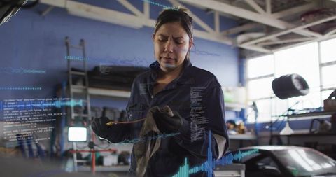Female Mechanic Inspecting Copper Tube in Workshop with Augmented Reality Diagnostics