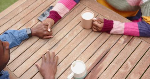 Romantic African American Couple Sharing Coffee Outdoors