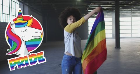 Woman Displaying Rainbow Flag for LGBT Pride Ethereal Unicorn Design - Download Free Stock Images Pikwizard.com