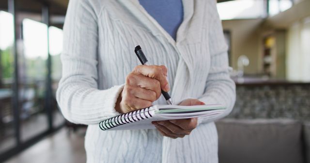 Senior Woman Writing in Notebook Indoors - Download Free Stock Images Pikwizard.com