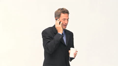 Businessman Balances Phone Call and Coffee Break