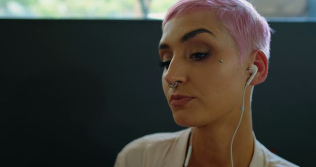 Young Caucasian woman listens to music on earphones, with copy space - Download Free Stock Photos Pikwizard.com