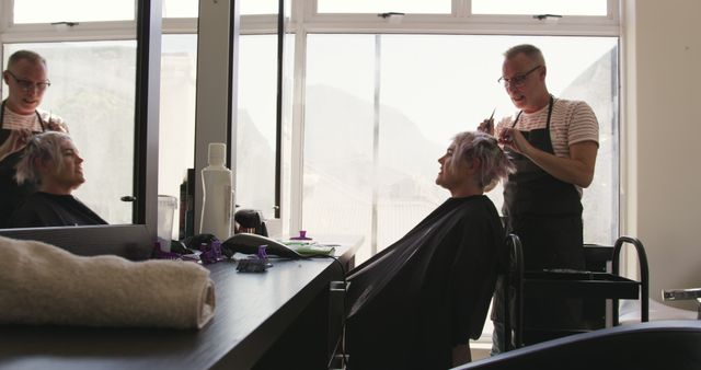 Hairstylist Cutting Hair in Modern Salon - Download Free Stock Images Pikwizard.com