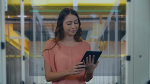 Woman Analyzing Data on Tablet in Modern Facility