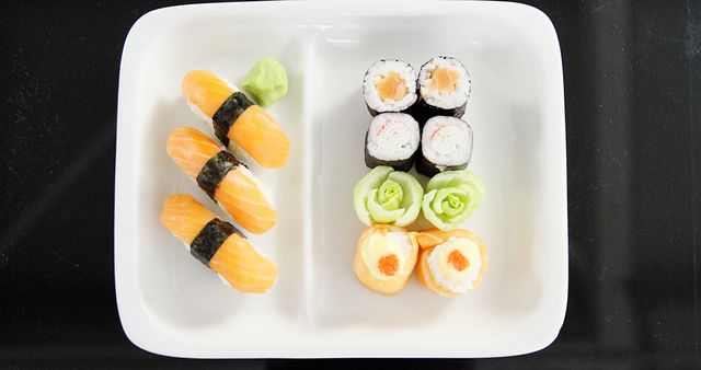 Assorted Sushi Platter with Nigiri and Rolls on White Plate - Download Free Stock Images Pikwizard.com