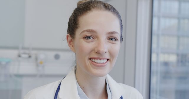 Smiling Female Doctor in Hospital With Window View - Download Free Stock Images Pikwizard.com