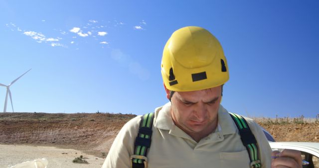 Construction Worker Wearing Safety Gear at Wind Farm Site - Download Free Stock Images Pikwizard.com