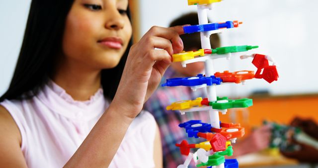 Student Building Colorful DNA Model in Science Class - Download Free Stock Images Pikwizard.com