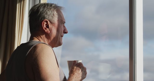 Senior Man Peacefully Drinking Coffee by Window - Download Free Stock Images Pikwizard.com