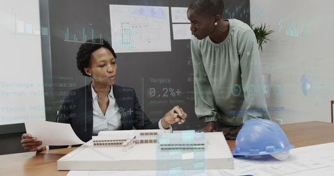 architects analyzing 3d building model with digital graph overlays - Download Free Stock Images Pikwizard.com