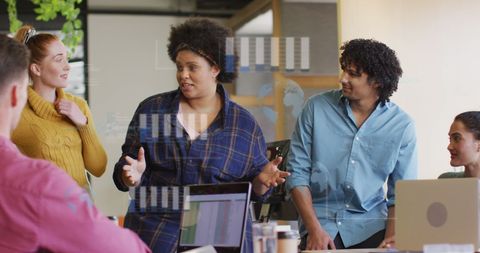 Diverse Team Engaged in Financial Data Analysis Discussion