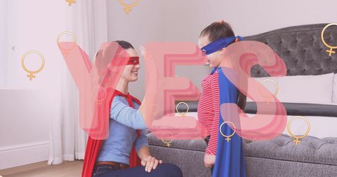 Mother and Daughter in Superhero Costumes Promoting Feminism