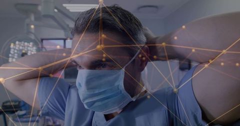 Surgeon Wearing Surgical Mask with Network Overlay in OR