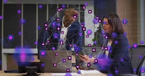 Business team collaborating with augmented reality overlay and mobile devices in boardroom