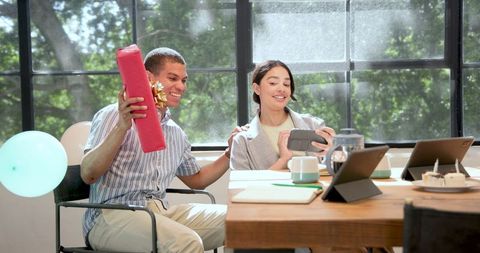 Office Celebration with Gift Giving and Selfie Taking