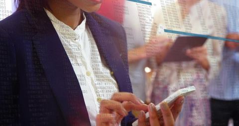 Professional woman typing on smartphone at networking event with code overlay
