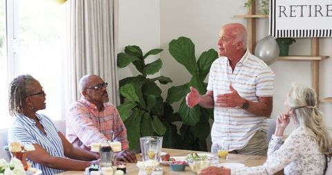 Senior Friends Celebrating Retirement with Cupcakes