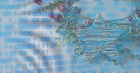 Rustic wooden star ornament with binary code overlay and festive berries