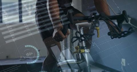 Cyclist Training Indoors on Exercise Bike with Data Overlays