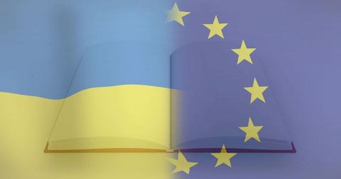 Open book displaying merged ukrainian and european union flags representing integration