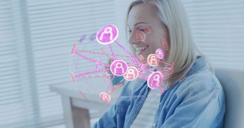 Woman Interacting with Digital Network Interface at Home Office