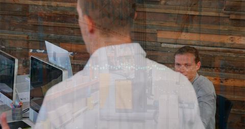 Teamwork and strategy discussion in modern office environment