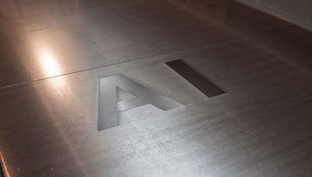 Brushed metal engraved ai signage with warm light reflection and industrial textured grain