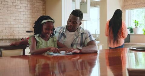 Family Quality Time with Parents Teaching Daughter at Home