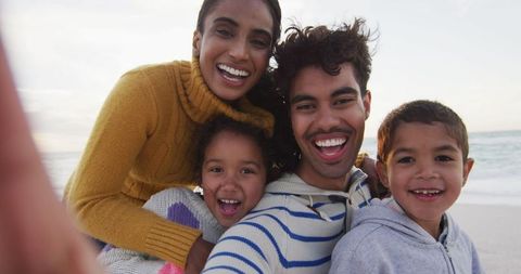 Joyful Family Making Memories with Beachfront Selfie