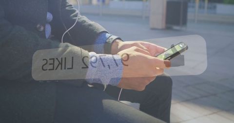 Man Checking Social Media Outdoors with Likes Overlay