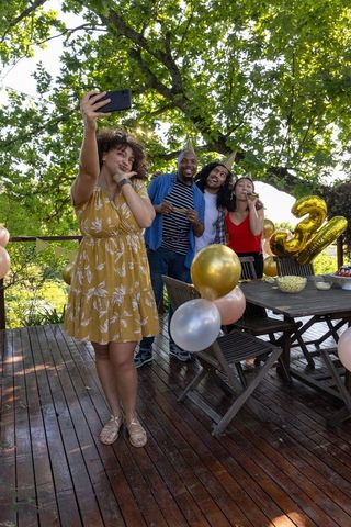 Diverse Friends Celebrating Birthday Party Taking Selfie Outdoors