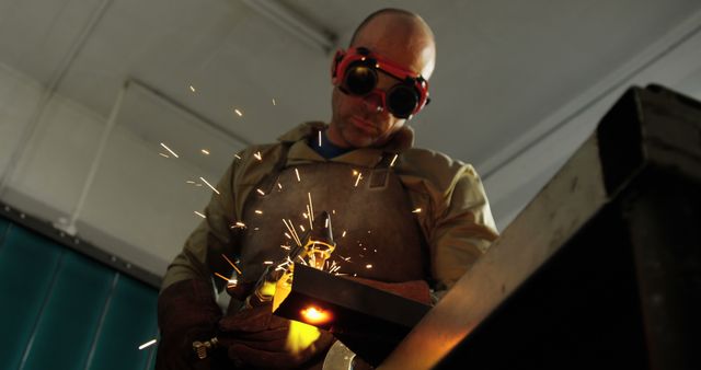 Industrial Worker Welding Metal in Workshop with Protective Gear - Download Free Stock Images Pikwizard.com