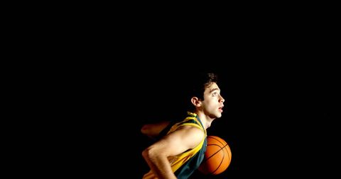 Focused Young Athlete Playing Basketball in Dramatic Lighting - Download Free Stock Images Pikwizard.com