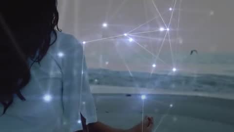 Woman Meditating on Beach With Tech Nodes at Dusk