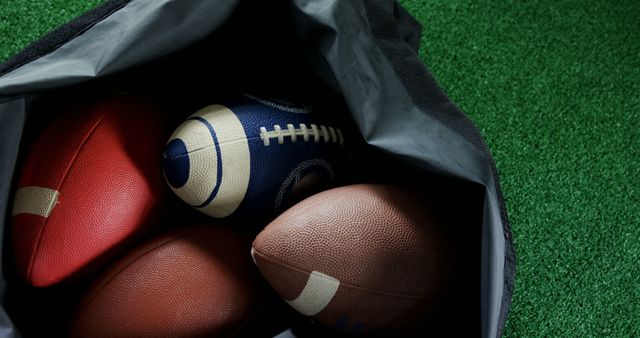 Bag of American Footballs on Turf Surface - Download Free Stock Images Pikwizard.com