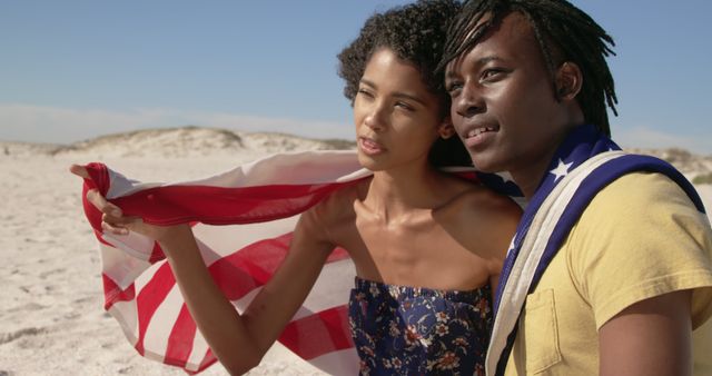 Couple with American Flag Embracing on Sunny Beach - Download Free Stock Images Pikwizard.com