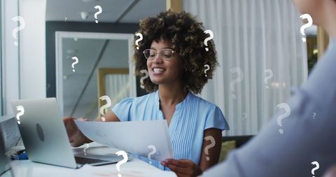 Diverse Businesswoman Reviewing Documents with Colleague